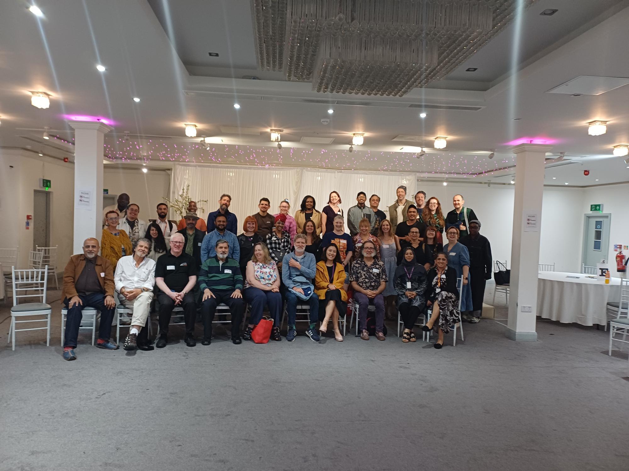 Open Space event participants posing for a group photograph.